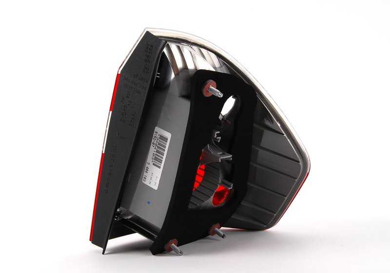 White left side panel rear light for BMW X3 E83 (OEM 63213404103). Original BMW.