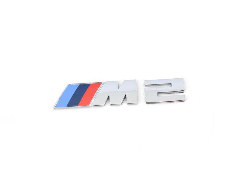 Rack avant d'emblème pour la série BMW 2 F87N (OEM 51148097498). BMW d'origine