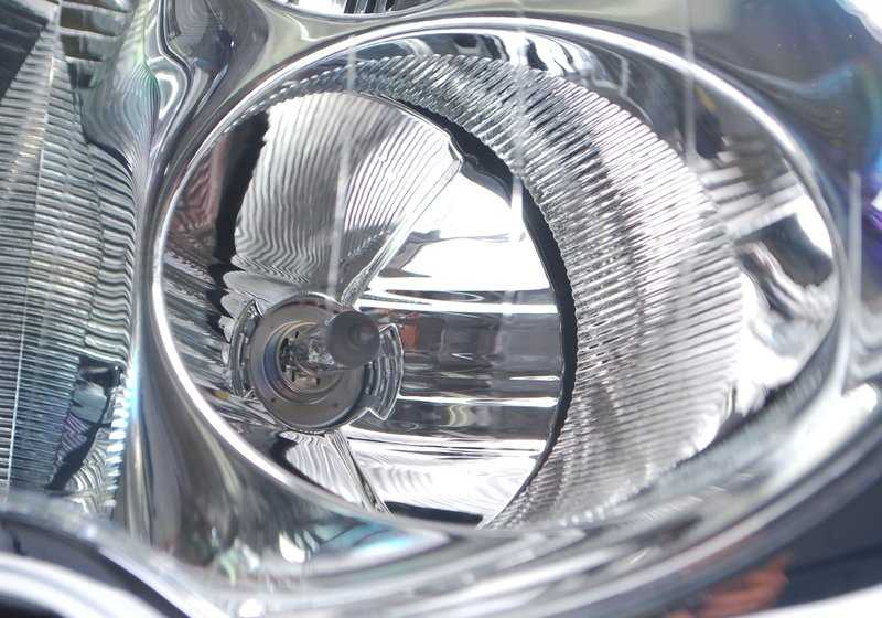 Faro de xenón izquierdo OEM 63126933839 para MINI R50, R53. Original MINI.