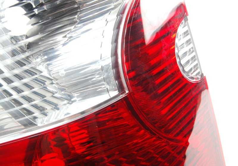 White left side panel rear light for BMW X3 E83 (OEM 63213404103). Original BMW.