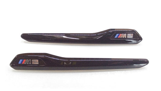 Zierleisten M Performance negras brillo OEM 51712459286 para BMW F87 M2. Mejora estética lateral con diseño deportivo. Original BMW.