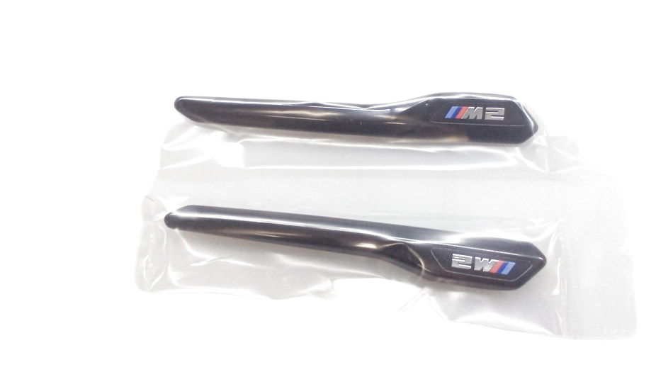 Zierleisten M Performance negras brillo OEM 51712459286 para BMW F87 M2. Mejora estética lateral con diseño deportivo. Original BMW.