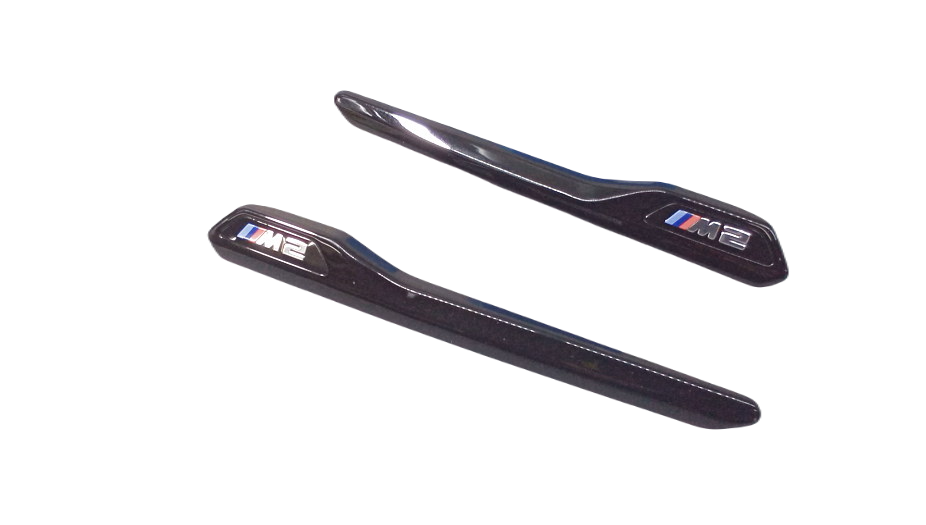 Zierleisten M Performance negras brillo OEM 51712459286 para BMW F87 M2. Mejora estética lateral con diseño deportivo. Original BMW.