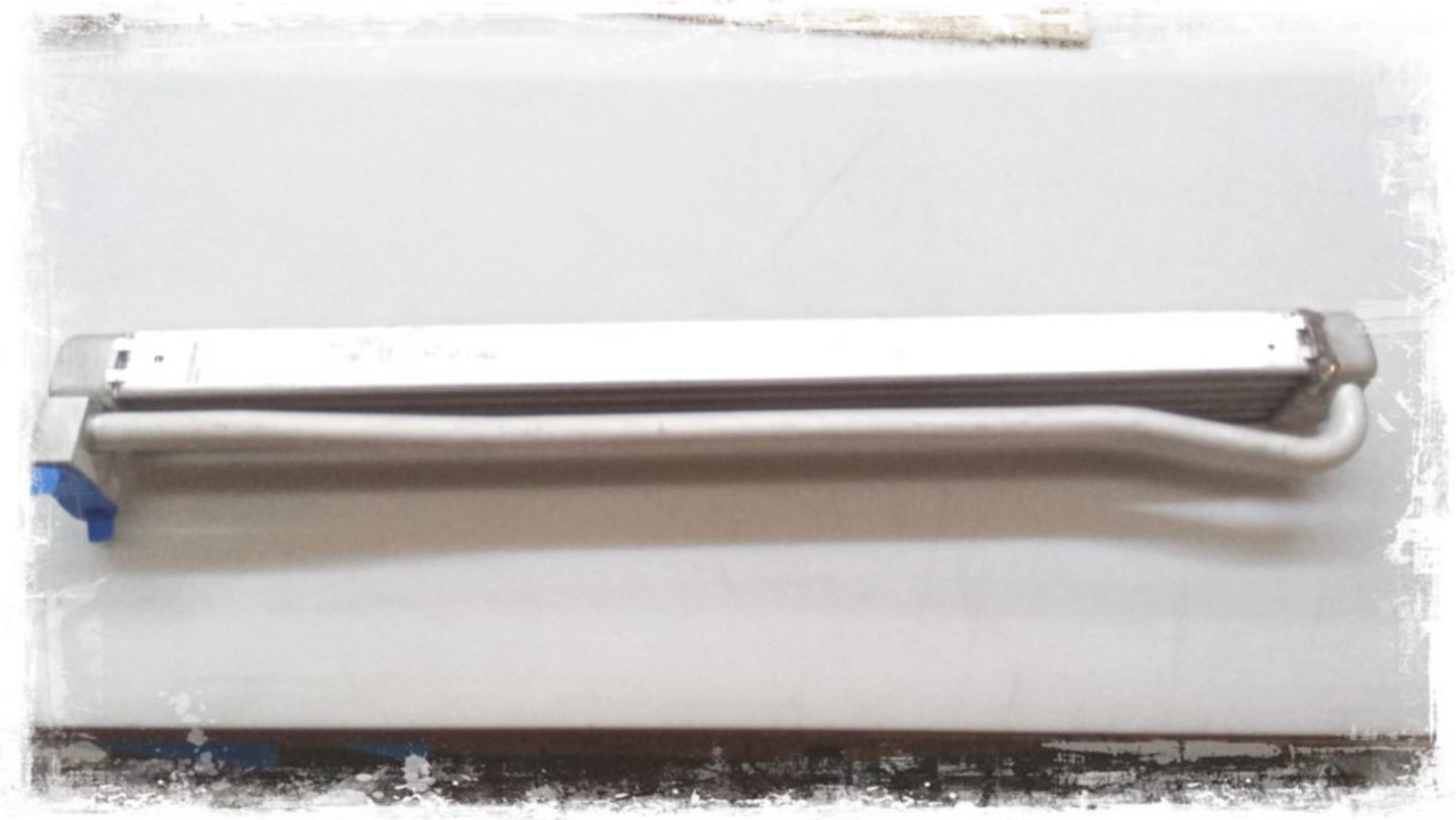 Radiador de aceite del motor OEM 17218854480 para BMW E46. Repuesto original BMW.