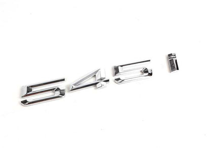 Emblem "545i" OEM 51147111711 for BMW E60 and E61 545i (2003–2005 models). Original BMW.