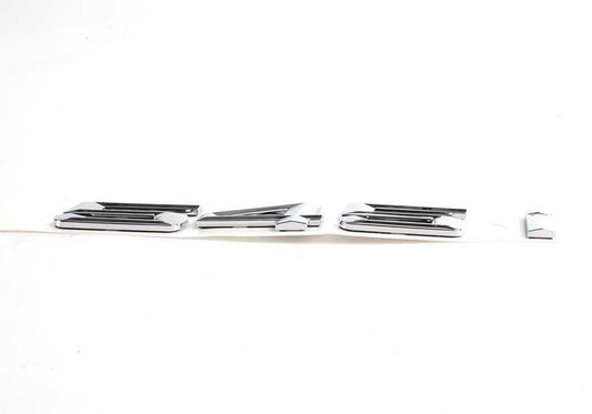 Emblem "545i" OEM 51147111711 for BMW E60 and E61 545i (2003–2005 models). Original BMW.