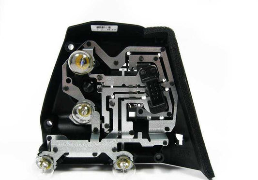 Portalámparas trasero izquierdo OEM 63217165865 para BMW E46. Original BMW.
