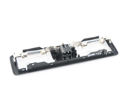 Luz de espejo retrovisor OEM 63312236821 para BMW E34, E32, E31. Pieza original BMW.