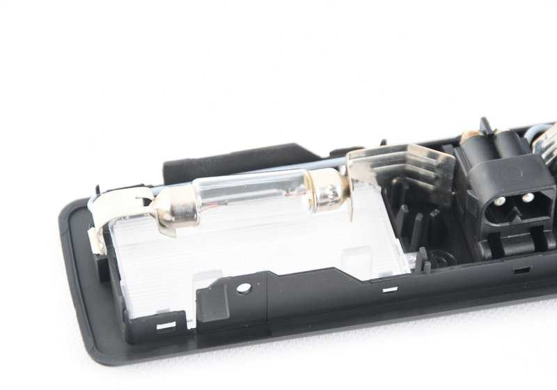 Luz de espejo retrovisor OEM 63312236821 para BMW E34, E32, E31. Pieza original BMW.