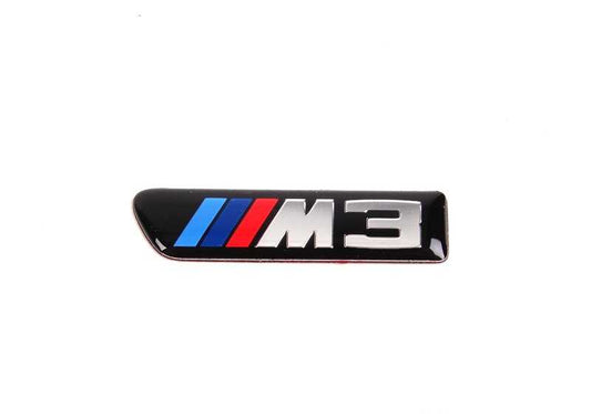 Emblema adhesivo lateral izquierdo OEM 51138042227 para BMW E90, E90N, E92, E92N, E93, E93N. Original BMW.