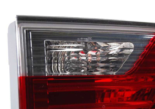 Heckpilot linke Hecktor für BMW x3 E83N (OEM 63217162213). Original BMW.