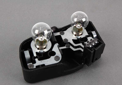 Soporte portabombillas trasero izquierdo OEM 63217165743 para BMW E46 {316i AL11, AL12, AL21, AL22, AL51, AN72, AN82, AY11, AY31, AY32}. Original BMW.