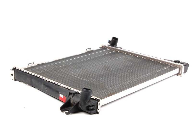 Radiador de refrigeración OEM 17111176900 para BMW E30 {320i, 323i}. Compatible con modelos de 1982 a 1991. Recambio original BMW.