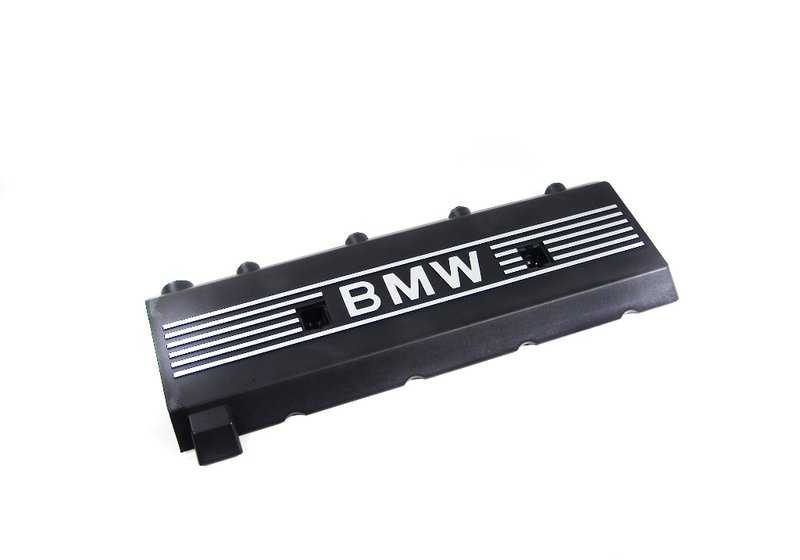 Left side cover for BMW 5 Series E39, 7 Series E38, 8 Series E31, X5 E53, Z8 E52 (OEM 11121702857). Original BMW.
