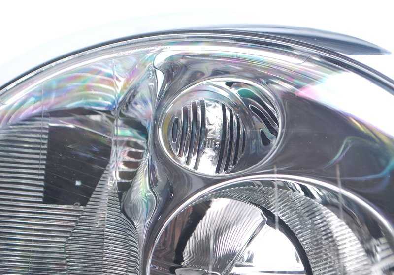Faro de xenón izquierdo OEM 63126933839 para MINI R50, R53. Original MINI.