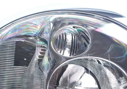 Faro de xenón izquierdo OEM 63126933839 para MINI R50, R53. Original MINI.