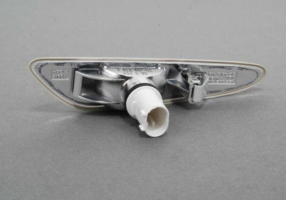 White left additional indicator light for BMW E83, E83N (OEM 63133418447). Original BMW.