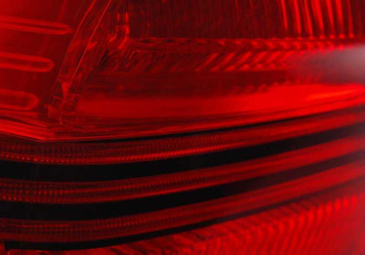 Left side tail light for BMW 3 Series E90 (OEM 63217161955). Original BMW.