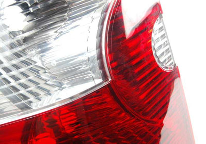White left side panel rear light for BMW X3 E83 (OEM 63213404103). Original BMW.