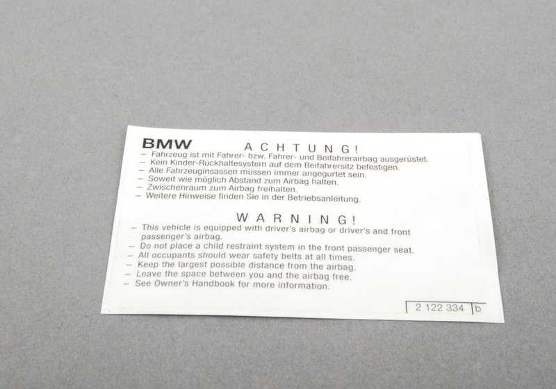 Airbag warning poster for BMW E81, E82, E87, E88, F20, F21, E36, E46, E90, E91, E92, E93, E34, E39, E60, E61, F07, F10, F11, F12, F13, F01 , F02 , F04, E31, E84, E83, F25, E53, E70, E71, E72, E85, E86, E89, E52 (OEM 712121222234). BMW original.