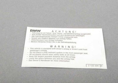 Airbag warning poster for BMW E81, E82, E87, E88, F20, F21, E36, E46, E90, E91, E92, E93, E34, E39, E60, E61, F07, F10, F11, F12, F13, F01 , F02 , F04, E31, E84, E83, F25, E53, E70, E71, E72, E85, E86, E89, E52 (OEM 712121222234). BMW original.