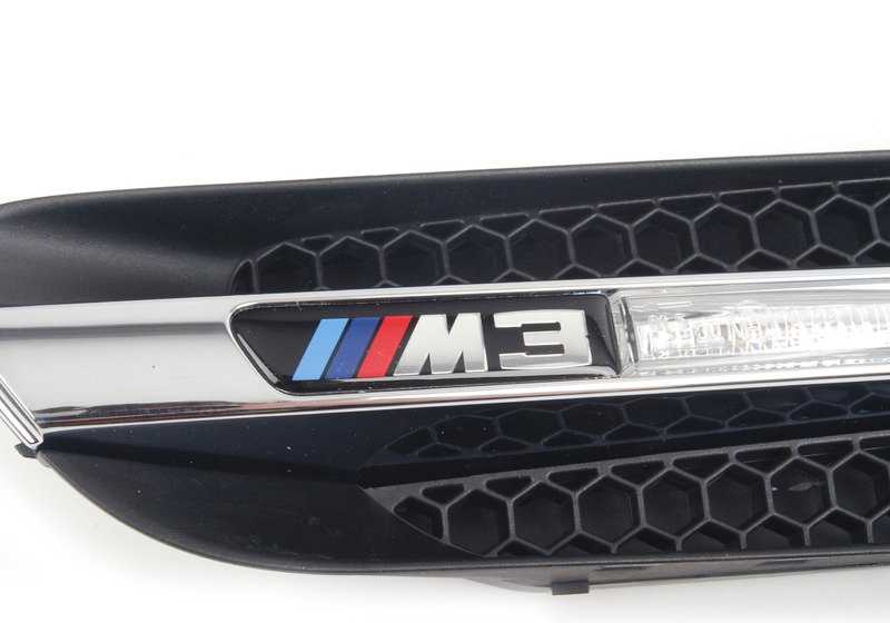 Side wall decorative grille with emblem left for BMW 3 Series E90, E90N (OEM 51138046447). Original BMW.