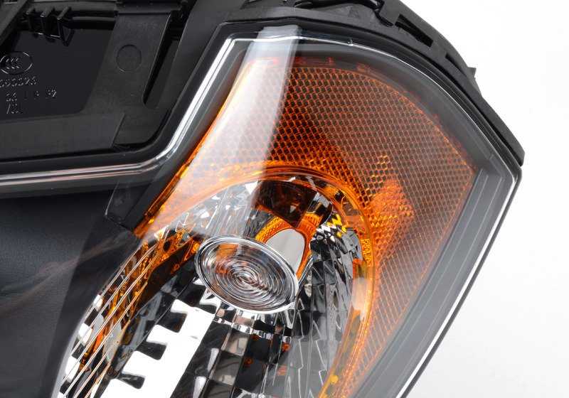 Faros delantero Bi-Xenón AHL izquierdo OEM 63123418395 para BMW E83. Original BMW.