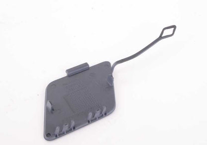 Tapa del gancho de remolque delantero imprimada OEM 51117335048 para BMW F01N, F02N. Repuesto original BMW.