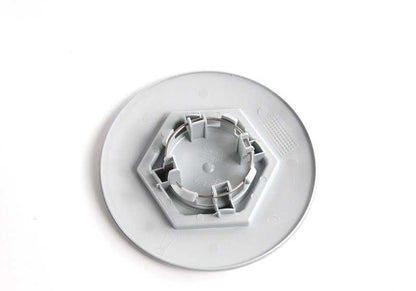 Central tire lid 36131180113 for BMW E34 and E32. Diameter 169mm. Compatible with several 518i and 518g models. Original BMW piece.