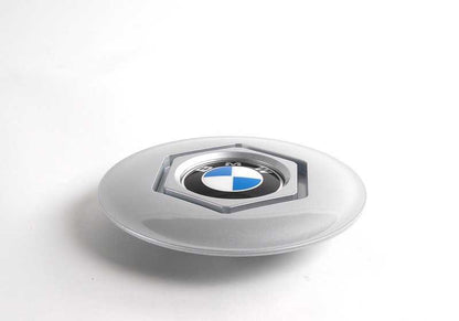 Central tire lid 36131180113 for BMW E34 and E32. Diameter 169mm. Compatible with several 518i and 518g models. Original BMW piece.