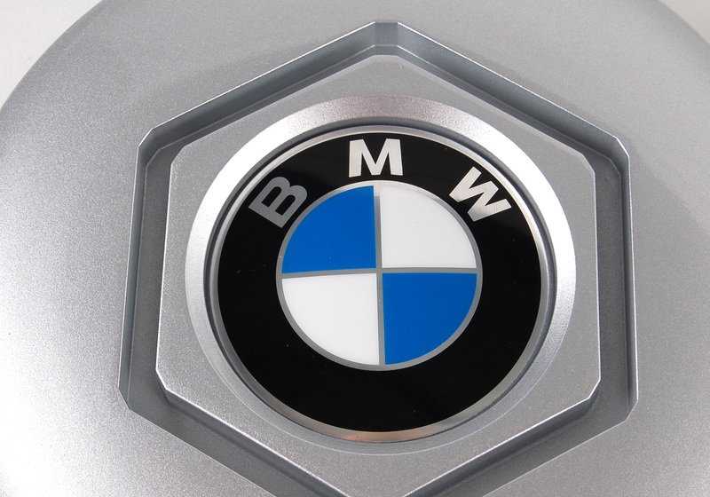 Central tire lid 36131180113 for BMW E34 and E32. Diameter 169mm. Compatible with several 518i and 518g models. Original BMW piece.
