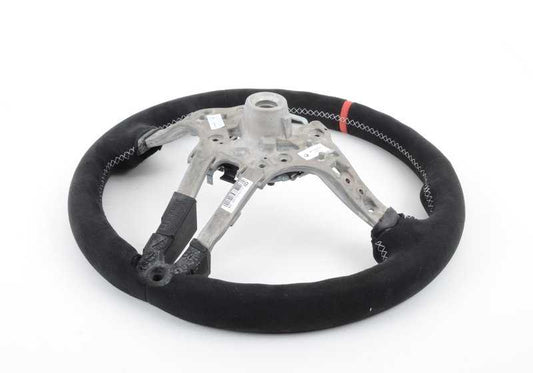 Volante deportivo M Performance OEM 32302344149 para BMW F15 y F16. Tapizado en Alcantara con detalles en carbono y marca roja central. Mejora el agarre y añade estilo racing. Original BMW.